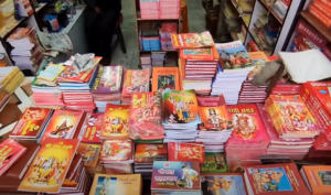 Spiritual and religious books from Saket Book Depot displayed on a shelf, showcasing a selection of literature on Ayodhya's religious traditions.