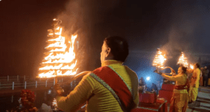 Evening Aarti ceremony at Saryu Ghat, featuring divine chants, flickering lamps, and a serene glow over the river. The ceremony attracts large crowds, especially on weekends.