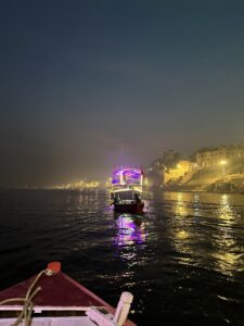 Boat ride at sunset on the Ganges River to witness Ganga Aarti at Dashashwamedh Ghat.