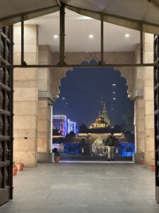 Exterior view of Kashi Vishwanath Temple with its golden spire and intricate carvings, dedicated to Lord Shiva.