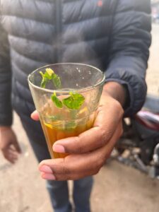 Enjoying unique Hajmola chai at Pappu Chai Wala shop near Assi Ghat in Varanasi.